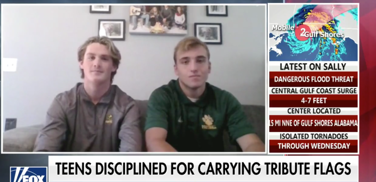 Two high schoolers suspended over carrying pro-first responder flags on football field awarded college scholarships