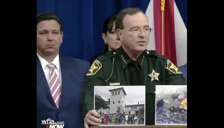 Florida sheriff holds up photos to the press showing difference between riots and peaceful protests