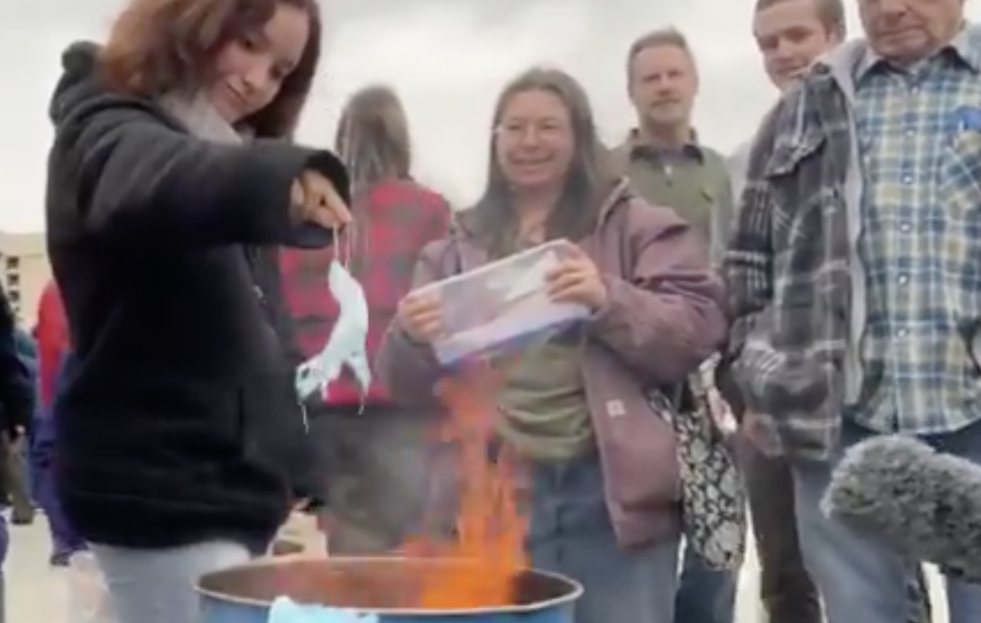 Families burn masks at rally against coronavirus emergency order at Idaho Capitol
