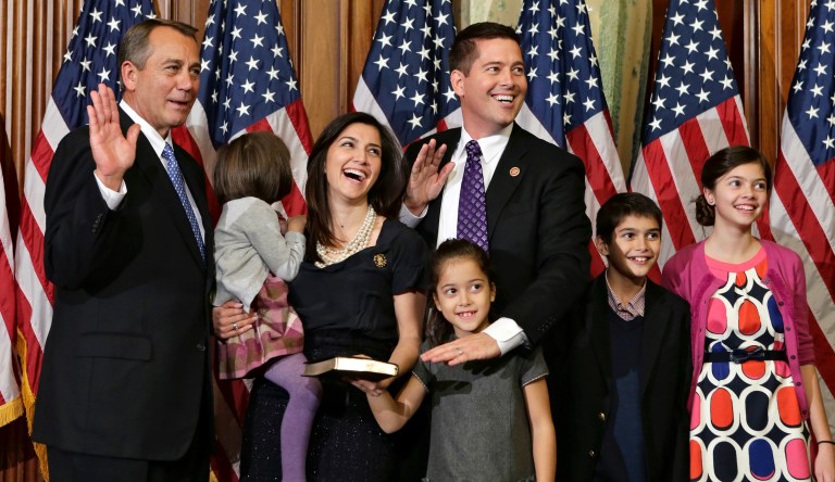 Rep. Sean Duffy, R-Wis., stands with his family for a ceremonial photo with Speaker of the House John Boehner, R-Ohio, left, in the Rayburn Room of the Capitol after the new 113th Congress convened on Thursday, Jan. 3, 2013, in Washington. The official oath of office for all members of the House was administered earlier in the House chamber.