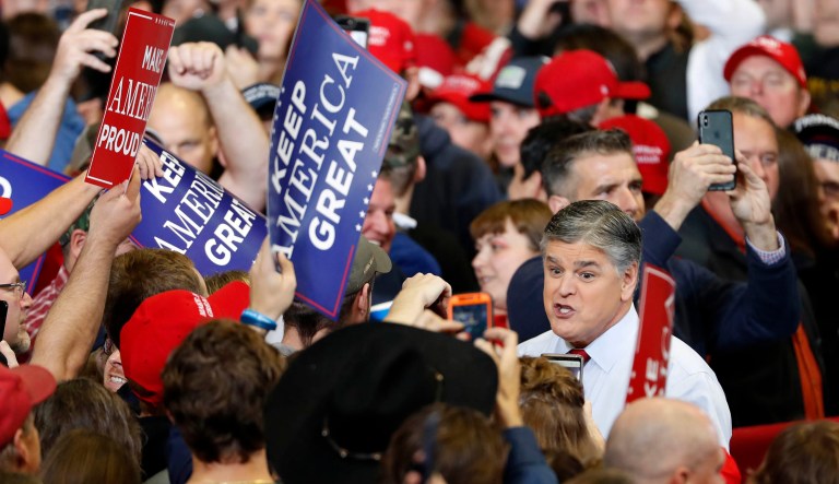 Television personality Sean Hannity speaks to members of the audience while signing autographs before the start of a campaign rally Monday, Nov. 5, 2018, in Cape Girardeau, Mo.