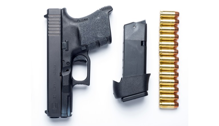A Glock 30SF .45 Auto semi-automatic pistol and thirteen rounds of hollow-point ammunition are seen with a Glock extended capacity magazine, in Alexandria, Va., Wednesday, Feb. 10, 2016. 