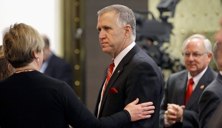 Sen. Thom Tillis, R-N.C., is greeted by lawmakers on the House floor during the opening session of the North Carolina Legislature in Raleigh, N.C., Wednesday, Jan. 14, 2015.