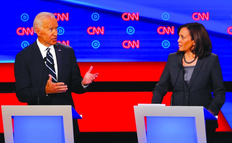 In this July 31, 2019, file photo, then-Democratic presidential candidate Sen. Kamala Harris, D-Calif., listens as Democratic presidential candidate former Vice President Joe Biden speaks during a Democratic presidential primary debate at the Fox Theatre in Detroit. Democratic presidential candidate former Vice President Joe Biden has chosen Harris as his running mate. 