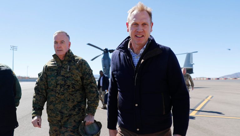 Acting Secretary of Defense Patrick Shanahan, right, and Joint Chiefs Chairman Gen. Joseph Dunford, left, walk across the tarmac at El Paso International airport after doing a Osprey aircraft tour of the US-Mexico border, Saturday, Feb. 23, 2019 in El Paso, Texas. 