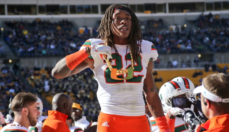 Miami defensive back Sheldrick Redwine (22) shows off their "U" turnover chain after recovering a fumble against Pittsburgh in an NCAA college football game, Friday, Nov. 24, 2017, in Pittsburgh.