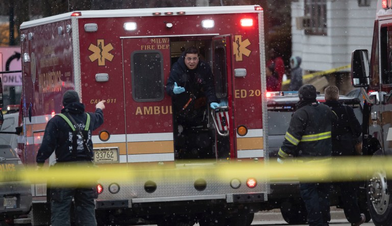 Police and emergency officials work on the scene of an active shooter on West State St. and North 35th street near Molson Coor in Milwaukee on Wednesday, Feb. 26, 2020.   Molson Coors said Wednesday there was an active shooter on its Milwaukee campus and ordered its employees to find a safe place to hide. The Milwaukee County Medical Examiner's Office said it had not yet been called to the scene, 3939 W. Highland Blvd.