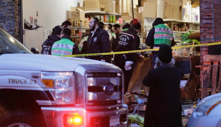 Emergency responders work at a kosher supermarket, the site of shooting in Jersey City, N.J., Wednesday, Dec. 11, 2019. The mayor of a New Jersey city says gunmen targeted the kosher market during a shooting that killed six people Tuesday.