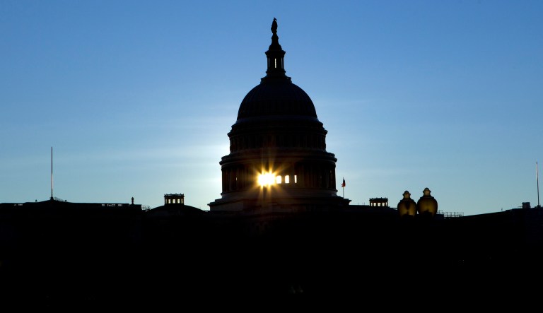The sun rises behind the U. S. Capitol a day after the Senate rejected competing Democratic and Republican proposals for ending the partial government shutdown, which is the longest in the nation's history, in Washington, Friday, Jan. 25, 2019.