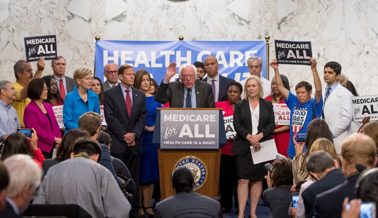 Sen. Bernie Sanders, I-Vt., center, accompanied by other democratic Senators and supporters, speaks at a news conference on Capitol Hill in Washington, Wednesday, Sept. 13, 2017, to unveil their Medicare for All legislation to reform health care.