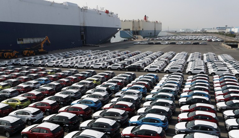 In this March 26, 2018, photo, Hyundai Motor's vehicles are seen at the company's export yard in Ulsan, South Korea. Unions at South Korea's two-largest automakers, Hyundai Motor and Kia Motors, say plans to revise a free trade deal with the United States involve concessions that will prevent local automakers from entering the fast-growing U.S. pick-up truck market.