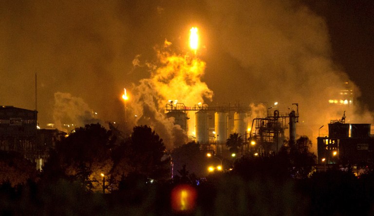 Smoke rise following a big explosion at an industrial hub near the port city of Tarragona, Spain, Tuesday, Jan. 14, 2020. A chemical emergency alert has been activated in northeastern Spain following a big explosion in an industrial zone near the port city of Tarragona, regional emergency services said Tuesday.