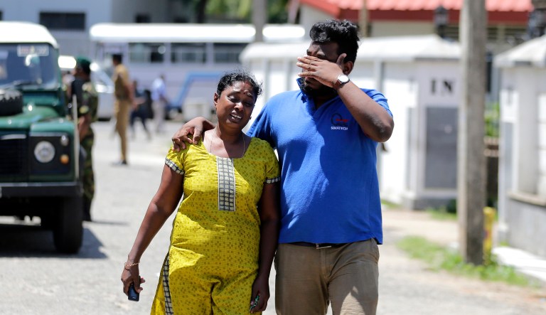 A Sri Lankan couple mourns as they leave from a mortuary after identifying the body of their relative killed in a blast, in Colombo, Sri Lanka, Monday, April 22, 2019. Sri Lankan authorities blame seven suicide bombers of a domestic militant group for coordinated Easter bombings that ripped through Sri Lankan churches and luxury hotels which killed and injured hundreds of people.