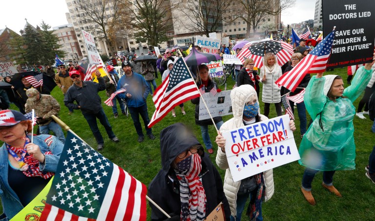 Protesters rally at the State Capitol in Lansing, Mich., Thursday, April 30, 2020. 