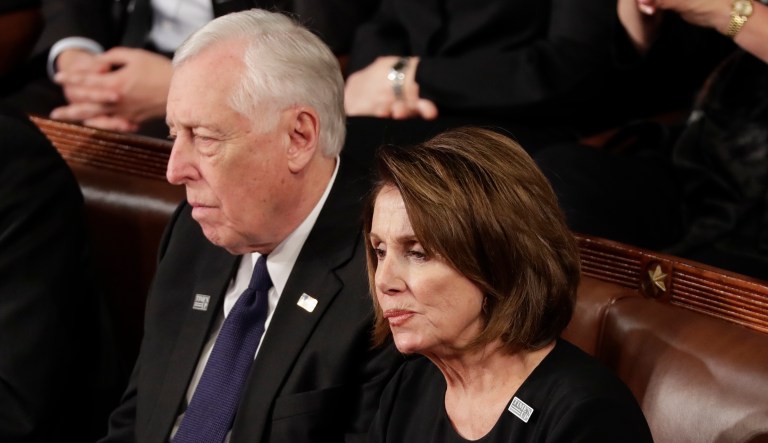 House Minority Leader Nancy Pelosi, D-Calif., and Minority Whip Steny Hoyer, D-Md., listen to the State of the Union address to a joint session of Congress on Capitol Hill in Washington, Tuesday, Jan. 30, 2018.