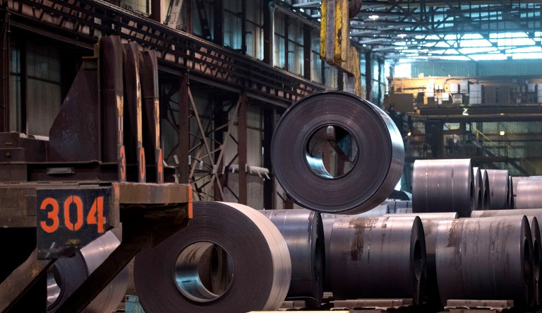 A coils of steel is moved by a crane at an Ontario steel plant. President Trump has exempted Canada and Mexico from 25 percent tariffs on the metal pending renegotiation of the North American Free Trade Agreement.