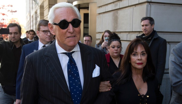FILE - In this Nov. 15, 2019, file photo, Roger Stone, left, with his wife Nydia Stone, leaves federal court in Washington, Friday, Nov. 15, 2019. 