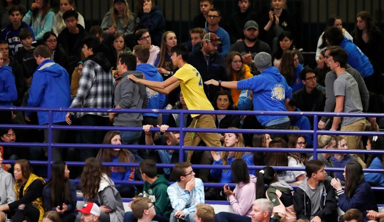 Students leave during a community vigil held to honor the victims and survivors of yesterday's fatal shooting at the STEM School Highlands Ranch, late Wednesday, May 8, 2019, in Highlands Ranch, Colo.