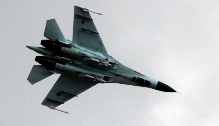 FILE - In this Tuesday, April 15, 2014 file photo, Ukrainian air force Su-27 fighter jet is in the sky outside Slovyansk, 160 kilometers (100 miles) from the Russian border, in eastern Ukraine. Ukraineâs military says that a Ukrainian fighter jet taking part in a joint U.S.-Ukrainian air force exercise has crashed, killing both pilots. The General Staff of Ukraineâs armed forces said the two-seat Su-27UB went down Tuesday, Oct. 16, 2018 in the Kmelnitskyi region.