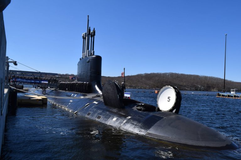 Sailors assigned to the Virginia-class attack submarine USS Colorado man their newly-commissioned boat in March.