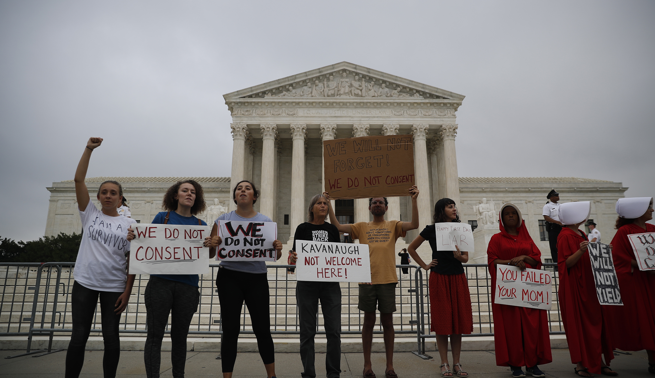 Down to work:  Kavanaugh jumps in with questions as protesters howl outside Supreme Court