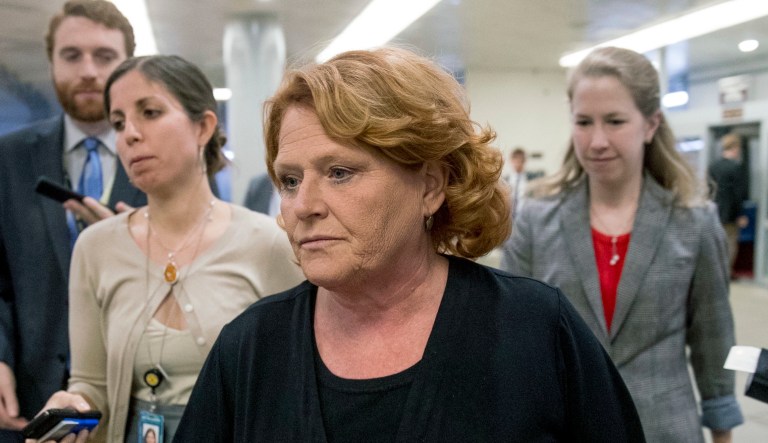 In this Sept. 25, 2018, file photo, Sen. Heidi Heitkamp, D-N.D., walks through the Senate subway as she arrives at the Capitol in Washington.