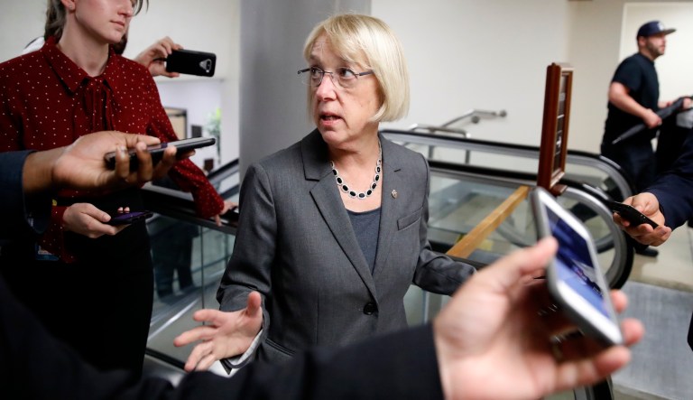 Sen. Joe Manchin, D-W.Va., talks with reporters as he walks on Capitol Hill, Monday, Sept. 24, 2018, in Washington.