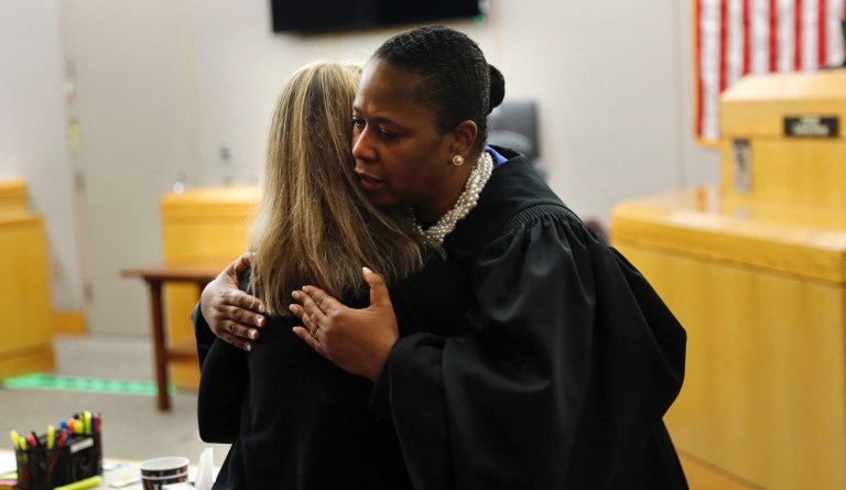 Judge Tammy Kemp gives Amber Guyger a hug before she leaves for jail. Kemp gave her one of her own Bibles and gave some encouragement to do something with her life after her 10-year sentence at the Frank Crowley Courts Building in Dallas, Wednesday, October 2, 2019. 