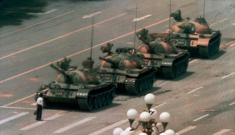 In this June 5, 1989, file photo, a Chinese man stands alone to block a line of tanks heading east on Beijing's Changan Blvd. in Tiananmen Square on Jeff Widener who created the iconic image of "tank man" says its time for China's government to "come clean" about the bloody events of June 3-4 1989.