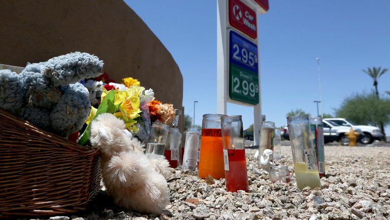 A makeshift memorial for Elijah Al-Amin is set up at a local Circle K store for the death of the stabbing victim Tuesday, July 9, 2019, in Peoria, Ariz. Peoria police arrested 27-year-old Michael Adams on suspicion of first-degree murder in the killing of 17-year-old Al-Amin, who was stabbed in his throat and back inside the store on July 4. Hundreds of people including a presidential candidate are speaking out on Twitter about the killing of a 17-year-old Muslim youth at a suburban convenience store by a white man who said he was threatened by the boy's rap music. 