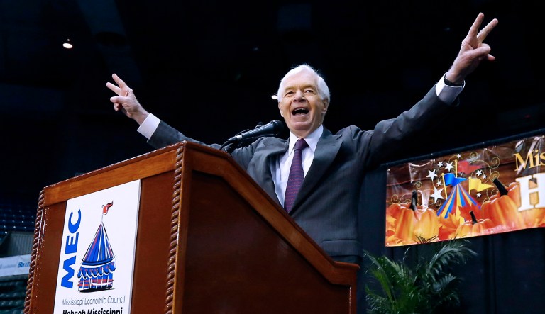 In this Oct. 29, 2014, file photo, Sen. Thad Cochran, R-Miss., responds to the crowd's applause following his short campaign speech at Hobnob, a casual gathering of business people at the Mississippi Coliseum in Jackson, Miss.