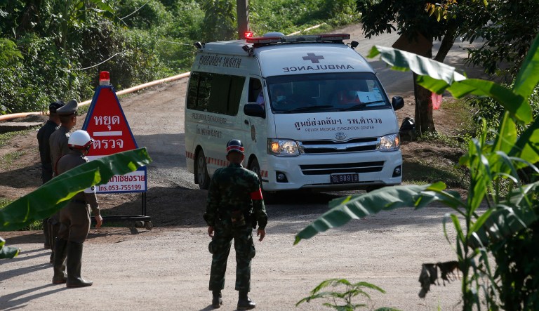An ambulance with flashing lights leaves the cave rescue area in Mae Sai, Chiang Rai province, northern Thailand, Monday, July 9, 2018. The ambulance has left the cave complex area hours after the start of the second phase of an operation to rescue a youth soccer team trapped inside the cave for more than two weeks.
