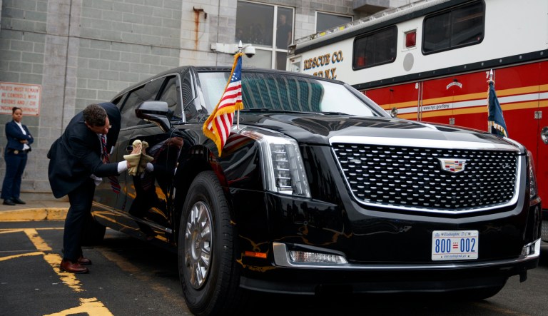 A Secret Service agent cleans the presidential limo before the arrival of Marine One carrying President Donald Trump at the Downtown Manhattan Heliport, Sunday, Sept. 23, 2018, in New York.