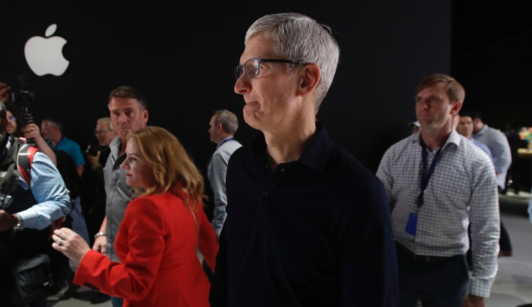 Apple CEO Tim Cook walks in the display room at the Apple Worldwide Developers Conference in San Jose, Calif., Monday, June 3, 2019.