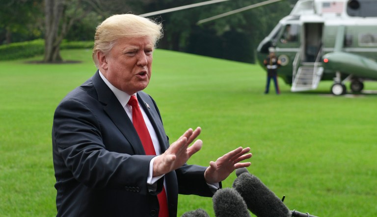 President Donald Trump speaks to reporters on the South Lawn of the White House in Washington, Monday, Oct. 8, 2018, as he heads to Marine One for the short trip to Andrews Air Force Base. Trump is traveling to Florida for the day.