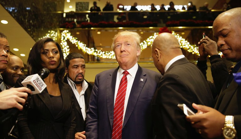 Republican Presidential candidate Donald Trump, center, joins a group of African-American religious leaders to speak to reporters in New York, Monday, Nov. 30, 2015. Trump met with a coalition of 100 African-American evangelical pastors and religious leaders in a private meeting at Trump Tower.