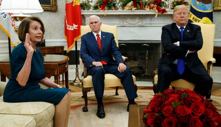 Vice President Mike Pence, center, listens as President Donald Trump argues with House Minority Leader Rep. Nancy Pelosi, D-Calif., during a meeting in the Oval Office of the White House, Tuesday, Dec. 11, 2018, in Washington. 