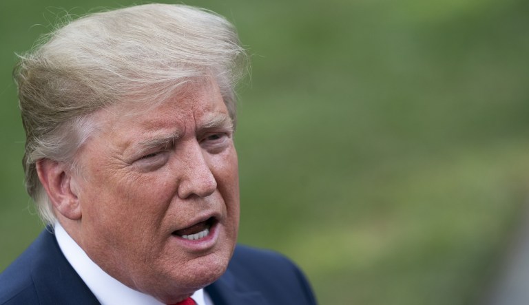 U.S. President Donald Trump speaks to members of the media on the South Lawn of the White House before boarding Marine One in Washington, D.C., U.S., on Wednesday, July 24, 2019.