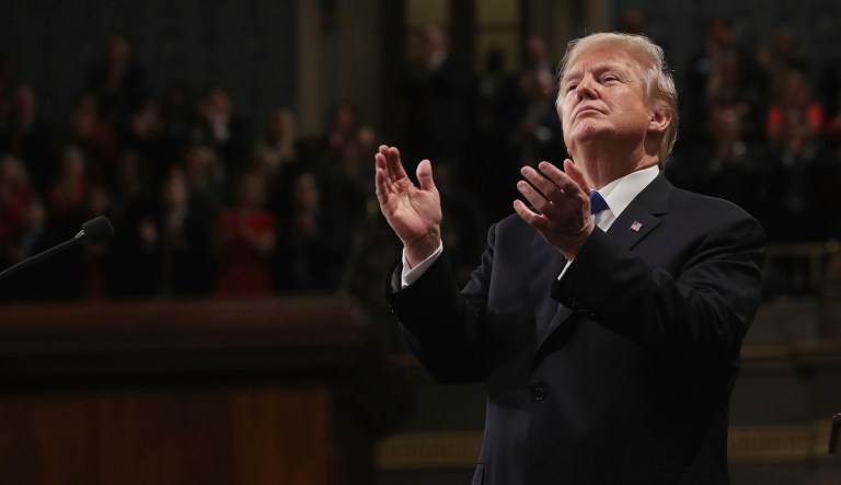 President Donald Trump claps at his first State of the Union address in the House chamber of the U.S. Capitol to a joint session of Congress Tuesday, Jan. 30, 2018 in Washington.
