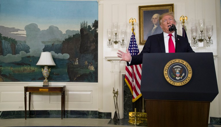 President Donald Trump speaks about the partial government shutdown, immigration and border security in the Diplomatic Reception Room of the White House, in Washington, Saturday, Jan. 19, 2019.