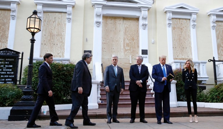 President Trump stands outside St. John's Church across Lafayette Park from the White House with Defense Secretary Mark Esper, from left, Attorney General William Barr, White House national security adviser Robert O'Brien, White House chief of staff Mark Meadows and White House press secretary Kayleigh McEnany. (AP Photo/Patrick Semansky)