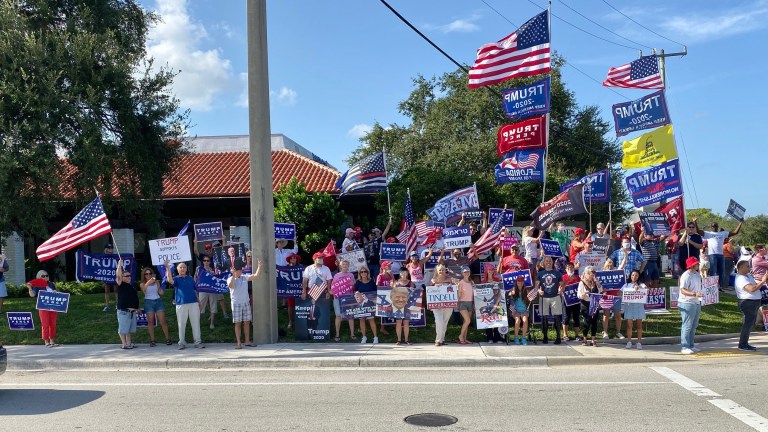 Trump supporters gather on a Friday afternoon in an undated photo take of the corner of Palm Beach Gardens Blvd. and Military Trail in Palm Beach Gardens, not far from President Trump's home at Mar-a-Lago.