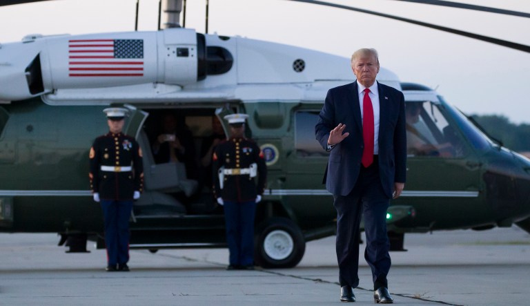 President Donald Trump waves as walks from Marine One to Air Force One to depart Cleveland-Hopkins International Airport, Friday, July 12, 2019, in Cleveland.