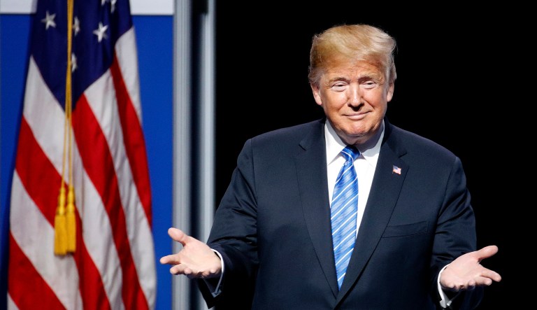 President Donald Trump reacts to the crowd during an appearance at the Veteran's of Foreign Wars national convention Tuesday, July 24, 2018, in Kansas City, Mo.