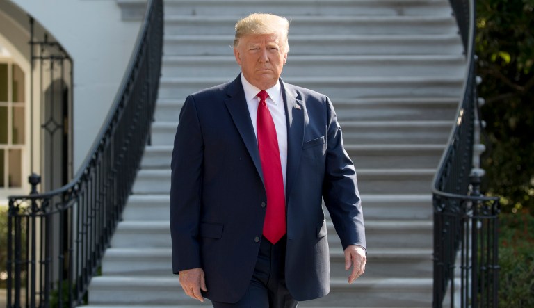 President Donald Trump walks towards members of the media on the South Lawn of the White House in Washington, Wednesday, Aug. 7, 2019, before boarding Marine One for a short trip to Andrews Air Force Base, Md., and then on to Dayton, Ohio, and El Paso, Texas, in the afternoon to praise first responders and console family members and survivors from two recent mass shootings.