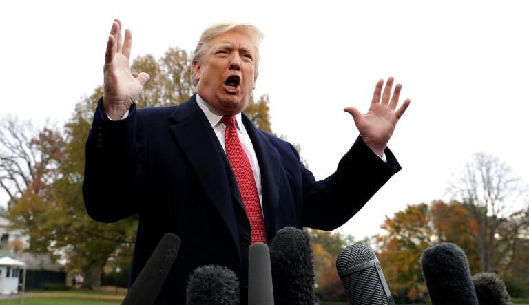 President Donald Trump talks to the media before boarding Marine One on the South Lawn of the White House, Friday, Nov. 9, 2018, in Washington.