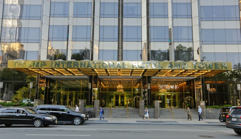 Pedestrains pass the entrance to the Trump International Hotel & Tower building Tuesday, May 31, 2016, in New York.
