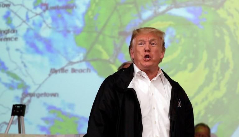 President Donald Trump gestures to first responders as he visits the Horry County Emergency Management center in the area impacted by Hurricane Florence, Wednesday, Sept. 19, 2018, in Conway, S.C.