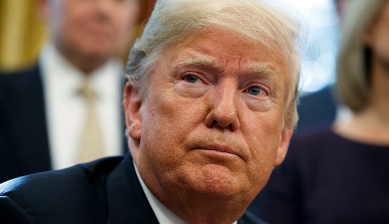 President Donald Trump listens to a question during a signing ceremony of the "Cybersecurity and Infrastructure Security Agency Act," in the Oval Office of the White House, Friday, Nov. 16, 2018, in Washington.