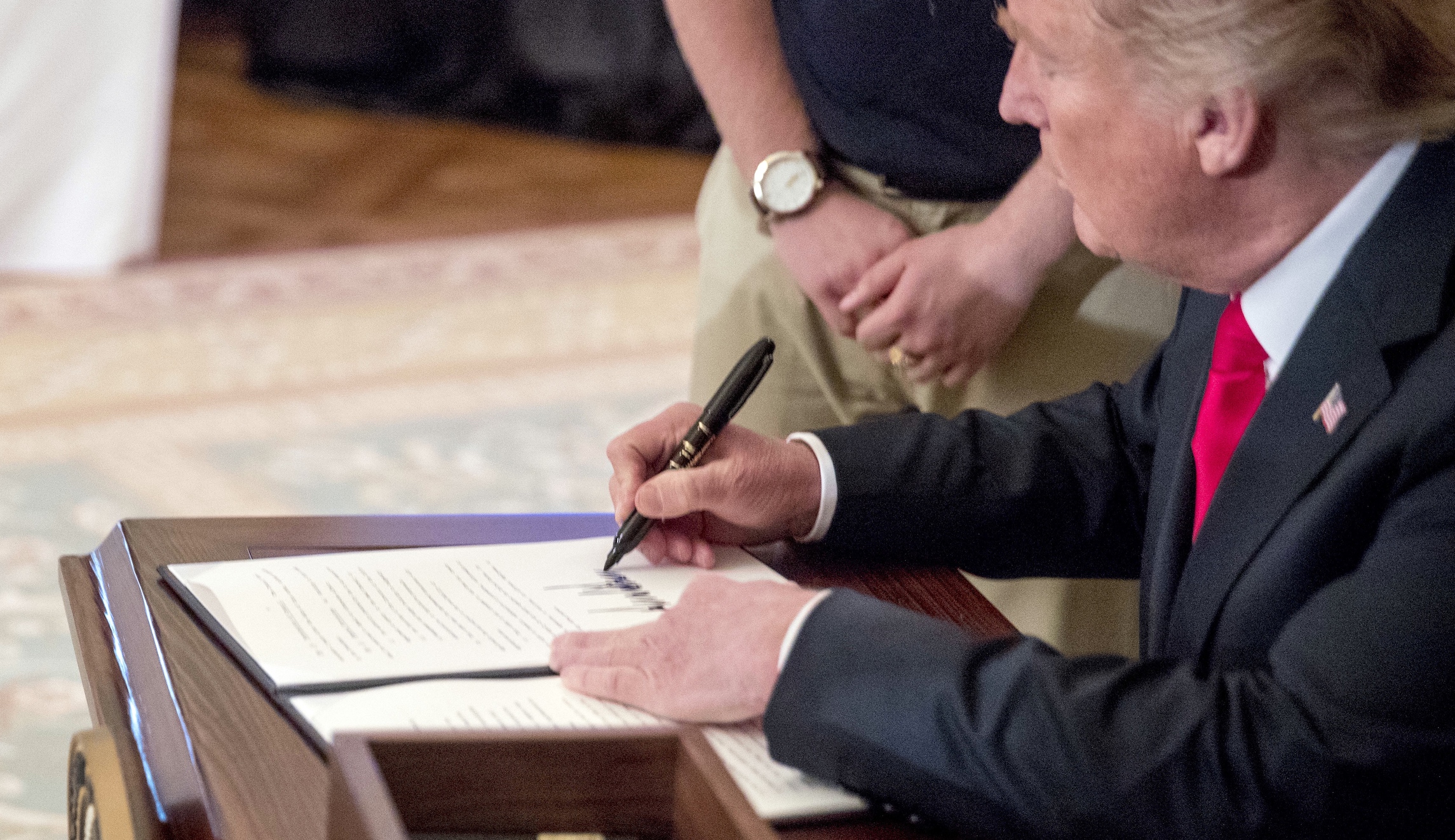 Trump signs law giving suicide lifeline a makeover